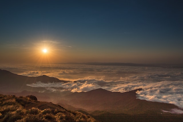 Clouds Hover Over Mountain